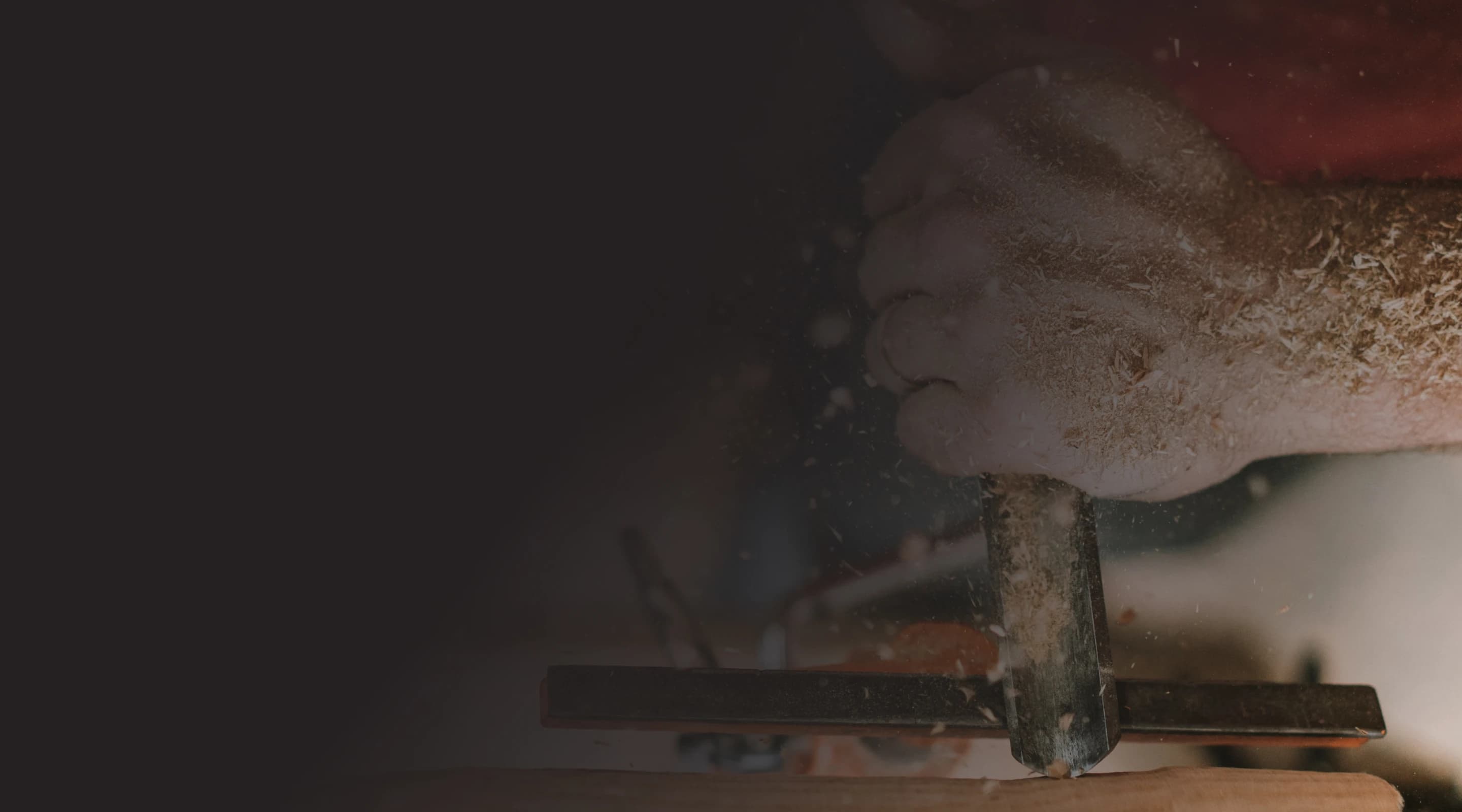 Person woodworking with power tools.